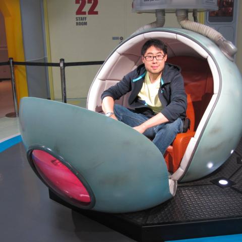 Me sitting in an egg-like chair.